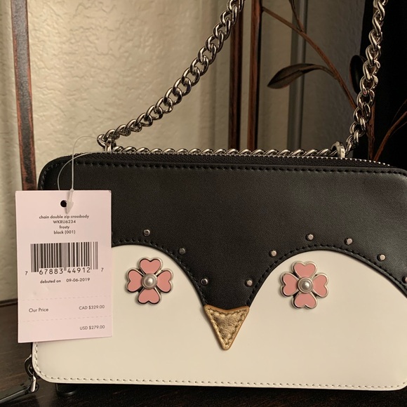 kate spade Handbags - Frosty penguin Kate spade chain zip crossbody